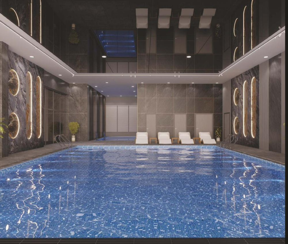 Indoor infinity-edge swimming pool — luxury residences near Gachibowli